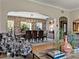 Open-concept dining area with a large table, modern chandelier, and stylish seating and decor at 524 Park S St, St Petersburg, FL 33707