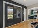 Inviting foyer with hardwood floors and view to the living room, featuring a fireplace at 524 Park S St, St Petersburg, FL 33707