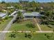 An elevated front exterior captures the lush lawn, stone work, and long driveway at 524 Park S St, St Petersburg, FL 33707