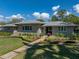 A stunning shot shows a stone house with meticulous landscaping and an inviting walkway to the front door at 524 Park S St, St Petersburg, FL 33707
