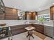 Modern kitchen featuring sleek wood cabinets, stainless steel appliances, and a marble countertop at 524 Park S St, St Petersburg, FL 33707