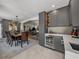 Modern kitchen featuring a wine cooler, gray cabinets, and seamless integration with the dining and living areas at 524 Park S St, St Petersburg, FL 33707