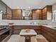 Modern kitchen features sleek wood cabinetry, marble countertops, and stainless steel appliances for a contemporary look at 524 Park S St, St Petersburg, FL 33707
