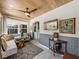 Bright sunroom with stylish furnishings and elegant wainscoting at 524 Park S St, St Petersburg, FL 33707