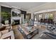 Bright living room with a fireplace, view into the dining area, and stylish furniture at 524 Park S St, St Petersburg, FL 33707