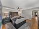 Spacious main bedroom boasts hardwood floors, soft textures, and natural light, for a relaxing atmosphere at 524 Park S St, St Petersburg, FL 33707