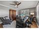 Spacious home office boasting a wooden armoire, ceiling fan, and a large desk with dual monitors at 524 Park S St, St Petersburg, FL 33707