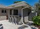 Stylish outdoor bar area with seating and a convenient shower, ideal for poolside entertaining at 524 Park S St, St Petersburg, FL 33707