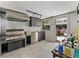 Modern outdoor kitchen with stainless steel appliances, grill, and a view of the outdoor dining area at 524 Park S St, St Petersburg, FL 33707