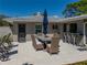 Outdoor patio featuring a dining table with seating, lounge chairs, and a bar counter, perfect for entertaining at 524 Park S St, St Petersburg, FL 33707