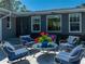 Inviting outdoor patio with comfortable seating around a glass table, perfect for gatherings at 524 Park S St, St Petersburg, FL 33707