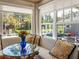 Relaxing sunroom overlooking the backyard, with large windows and comfortable seating creating a serene retreat at 524 Park S St, St Petersburg, FL 33707