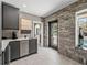 Modern wet bar featuring sleek countertops, stainless steel appliances, and access to the patio at 524 Park S St, St Petersburg, FL 33707