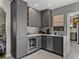 Stylish wet bar featuring modern cabinetry, sleek countertops, and a built-in beverage refrigerator at 524 Park S St, St Petersburg, FL 33707