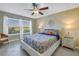 Comfortable bedroom with a large window and view of the golf course at 6181 Bahia Del Mar Blvd # 112, St Petersburg, FL 33715
