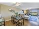 Dining area that opens to a living room and has a view of the golf course at 6181 Bahia Del Mar Blvd # 112, St Petersburg, FL 33715