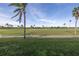 Scenic view of the lush, manicured golf course with palm trees and tropical landscaping at 6181 Bahia Del Mar Blvd # 112, St Petersburg, FL 33715