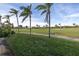 Picturesque view of the sprawling golf course with mature palm trees and beautifully kept grounds at 6181 Bahia Del Mar Blvd # 112, St Petersburg, FL 33715