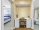 View from a hallway shows a desk area with chair between a bedroom and a bathroom at 6181 Bahia Del Mar Blvd # 112, St Petersburg, FL 33715