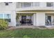 Ground floor patio with outdoor seating and view of the grass and landscaping at 6181 Bahia Del Mar Blvd # 112, St Petersburg, FL 33715