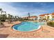 Inviting community pool surrounded by lounge chairs and manicured landscaping, with a view of the condos at 6181 Bahia Del Mar Blvd # 112, St Petersburg, FL 33715
