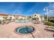 Pool and hot tub area surrounded by lounge chairs and tropical landscaping at 6181 Bahia Del Mar Blvd # 112, St Petersburg, FL 33715