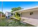 Landscaped backyard featuring a covered patio, perfect for outdoor entertaining at 679 71St N Ave, St Petersburg, FL 33702