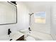 Updated bathroom with sleek black fixtures, subway tile, and a window for natural light at 679 71St N Ave, St Petersburg, FL 33702