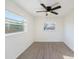Sunny bedroom with large windows, vinyl plank flooring, and ample natural light at 679 71St N Ave, St Petersburg, FL 33702