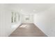 Bright living space featuring wood-look floors, fresh white walls, and recessed lighting at 679 71St N Ave, St Petersburg, FL 33702
