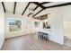 Open-concept living space with high ceilings, modern light fixtures, and vinyl plank flooring at 679 71St N Ave, St Petersburg, FL 33702