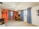 Bright bedroom with a ceiling fan, a desk, and ample natural light from the windows at 6905 El Camino Paloma St, Port Richey, FL 34668