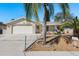 Charming single-story home with a well-manicured lawn and a two-car attached garage at 6905 El Camino Paloma St, Port Richey, FL 34668