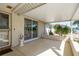 Charming covered patio with brick accents and ample space for outdoor living and dining at 6905 El Camino Paloma St, Port Richey, FL 34668