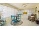 Bright sun room with tile floor, a small seating arrangement, and lots of natural light at 6905 El Camino Paloma St, Port Richey, FL 34668