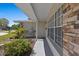 Welcoming front porch with stone accents and well-placed landscaping elements at 8006 N Ola Ave, Tampa, FL 33604