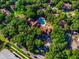 Aerial view of community featuring pool, and lush green landscape at 8647 Mallard Reserve Dr # 104, Tampa, FL 33614