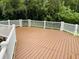 Community deck with vinyl railing overlooking tropical landscaping at 8647 Mallard Reserve Dr # 104, Tampa, FL 33614