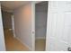 Entryway with tiled floors leading to closet with wire shelving at 8647 Mallard Reserve Dr # 104, Tampa, FL 33614
