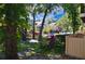 Beautiful two-story building with a swimming pool, tropical plants, and vibrant flowers at 8647 Mallard Reserve Dr # 104, Tampa, FL 33614