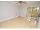 Comfortable living area with tile floors and sliding glass doors that lead to the patio at 8647 Mallard Reserve Dr # 104, Tampa, FL 33614