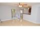 Inviting living room with tile flooring, ceiling fan, and sliding glass doors to the patio at 8647 Mallard Reserve Dr # 104, Tampa, FL 33614