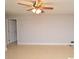 Neutral living room with tile flooring and a ceiling fan at 8647 Mallard Reserve Dr # 104, Tampa, FL 33614