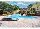 Beautiful swimming pool area with jacuzzi, lounge chairs, and well-maintained brick patio near buildings at 8647 Mallard Reserve Dr # 104, Tampa, FL 33614