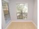 Bright room featuring tile floors, white trim, and a large window with privacy blinds at 8647 Mallard Reserve Dr # 104, Tampa, FL 33614