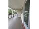 View of the porch with palm trees in the background at 946 Virgina # 304, Dunedin, FL 34698