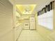 Kitchen with tile floors, white appliances, and a drop ceiling at 946 Virgina # 304, Dunedin, FL 34698