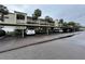 Covered parking area with designated spaces for residents and guests within the complex at 946 Virgina # 304, Dunedin, FL 34698