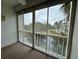 Patio with a view of the serene pond, surrounded by lush trees, creating a tranquil outdoor space at 946 Virgina # 304, Dunedin, FL 34698