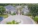 Stunning clubhouse entrance featuring elegant architecture and lush landscaping that welcomes residents and guests at 10205 Courtney Palms Blvd # 304, Tampa, FL 33619
